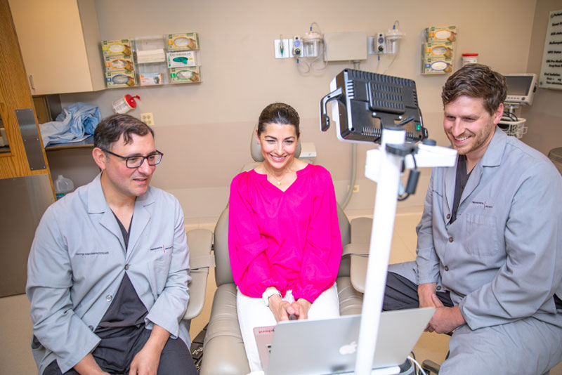 dr mandelaris and dr degroot discussing dental implants
