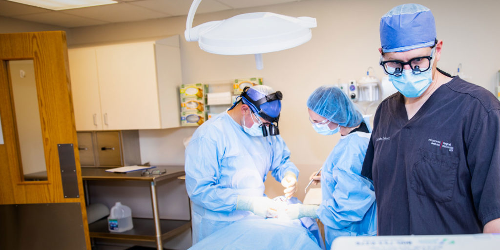 dr mandelaris performing dental procedure