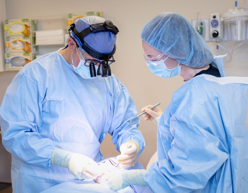 dr mandelaris performing surgical orthodontics procedure
