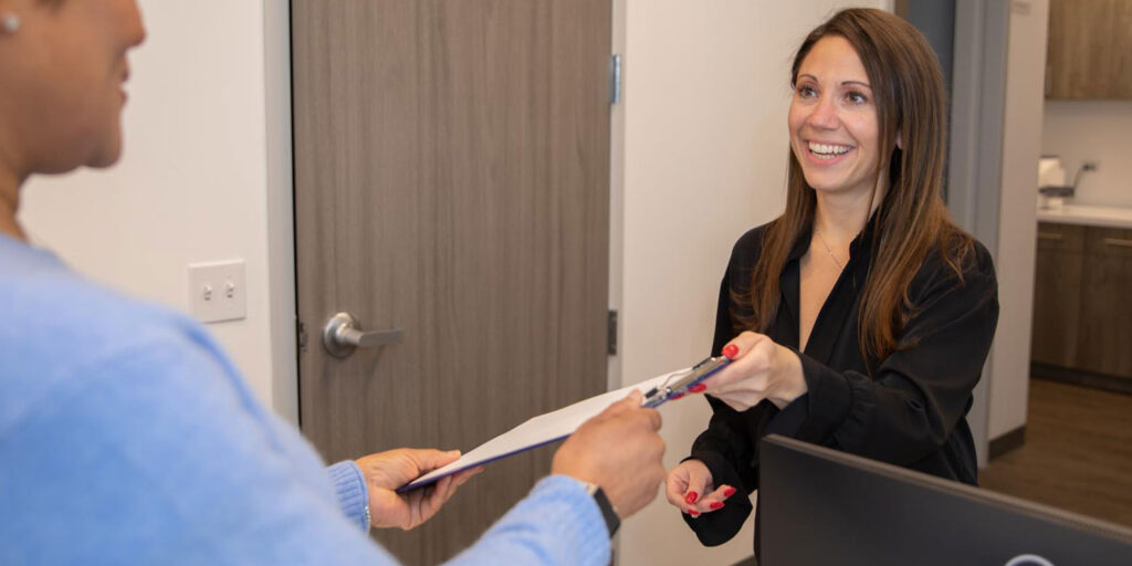 dental patient checking in at front desk