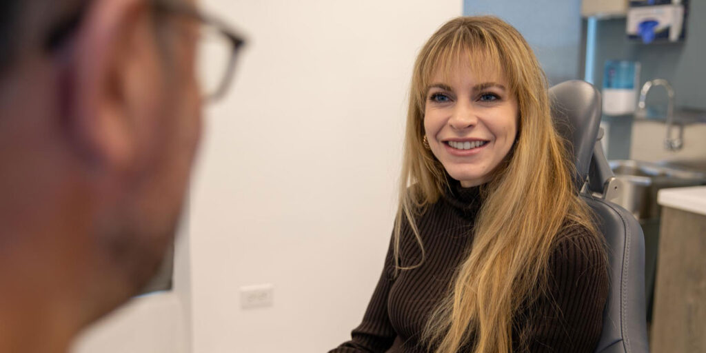 dental patient smiling in exam chair